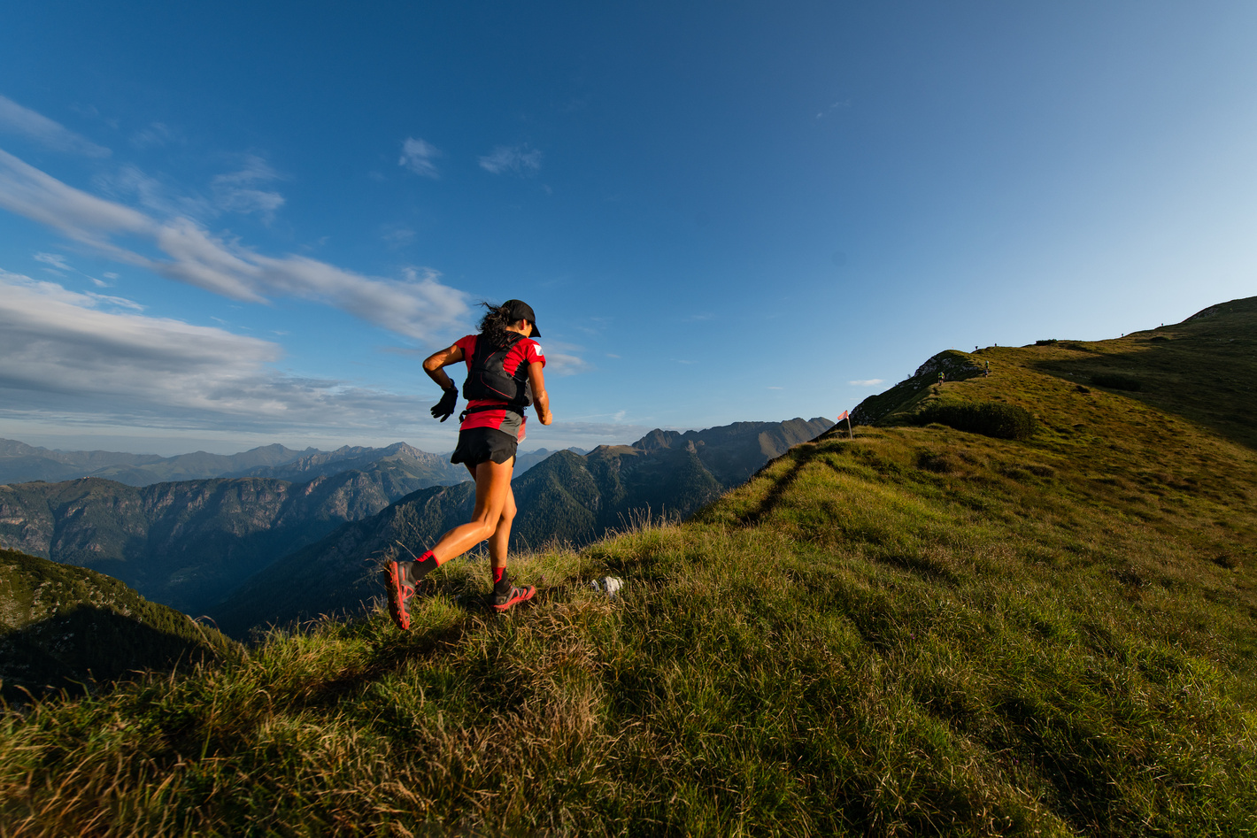 Person Running on a Mountain Ridge